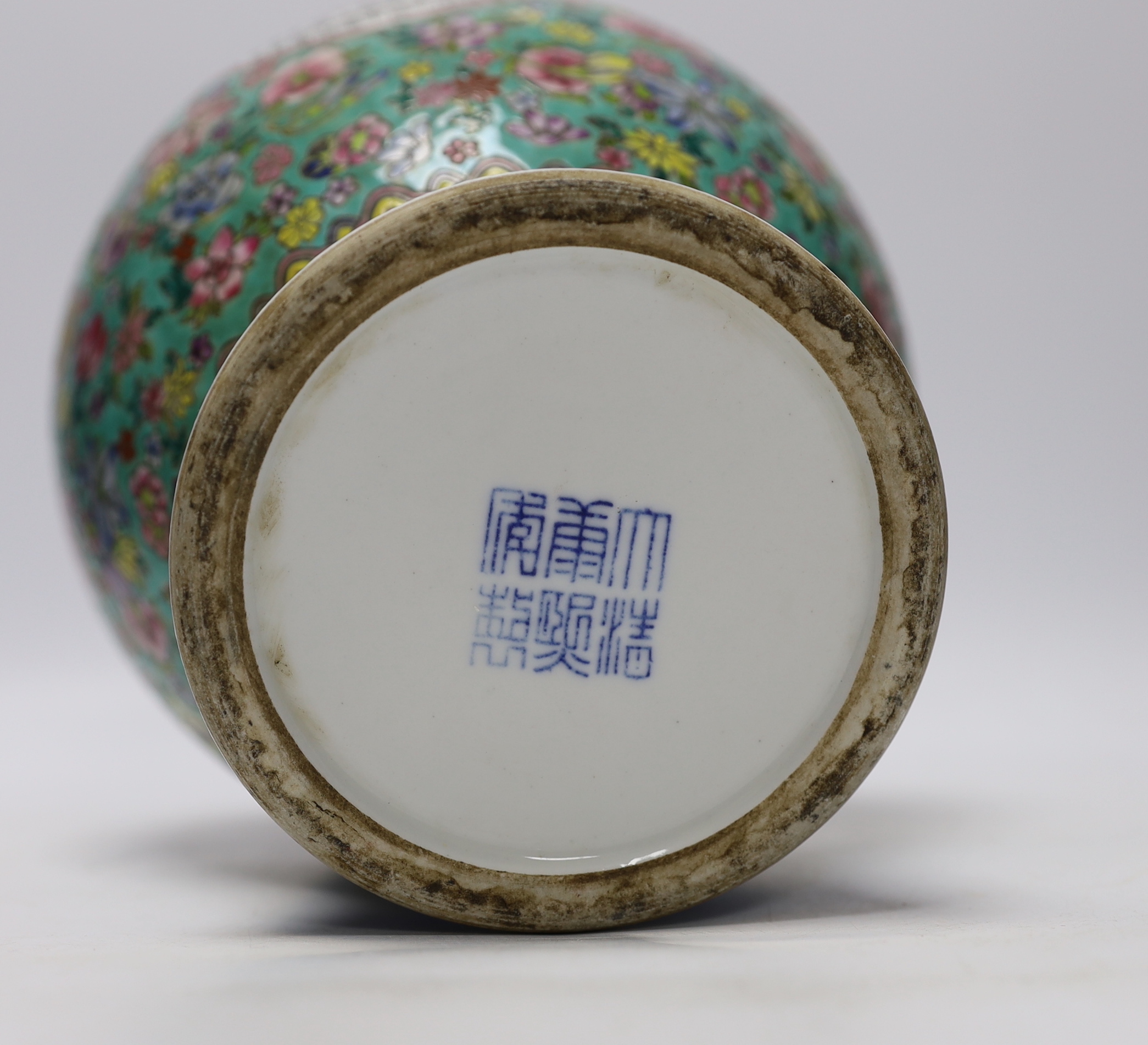 A Chinese famille rose vase, decorated with peaches and flowers, 35cm high